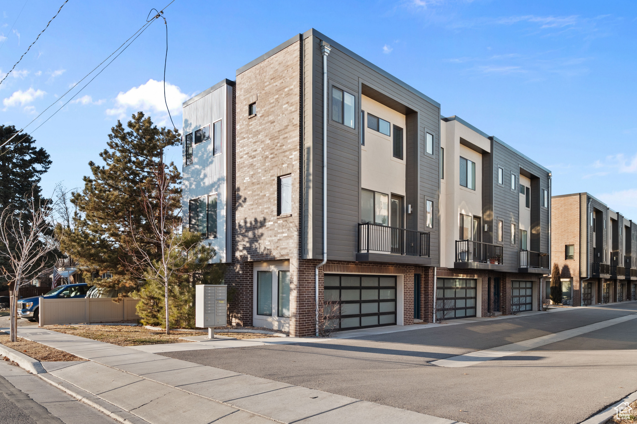 Location, location, location!   This townhome checks all the boxes in the heart of Brickyard!  Conveniently located, The Brickyard Lofts are just two minutes from the freeway, a grocery store, shopping, and downtown Sugarhouse. This end unit features beautiful, custom white cabinetry with granite countertops throughout the home. Additional cabinetry on the second floor is perfect for extra storage and counter space.  The large master suite features a walk-in closet, along with additional cabinetry in the master bath. With extra windows along the north side, plenty of natural light fills the space.  Each unit has a private, fully fenced backyard with an entrance from both the second floor and the garage. The two-car garage offers ample space on either side for additional storage. Up/down shades will also be included throughout the home.  With beautiful finishes, extra custom cabinetry, private yards, and a central location, you'll be impressed. Don't miss it!