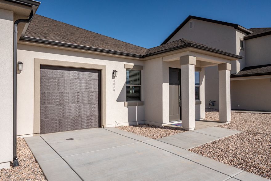 Just completed twin home, new construction offering 993 sq. ft. of efficient, modern living with a thoughtfully designed open floor plan. The kitchen and great room connect seamlessly, creating a bright and functional space for everyday living. Upgraded finishes and contemporary fixtures add a polished, modern feel throughout. The primary suite includes an attached bath, while a second bedroom and full bath provide flexibility for guests, workspace, or hobbies. Fully landscaped yard, covered patio, and attached one-car garage complete the home. A low-maintenance, move-in-ready option with modern design in a growing neighborhood.