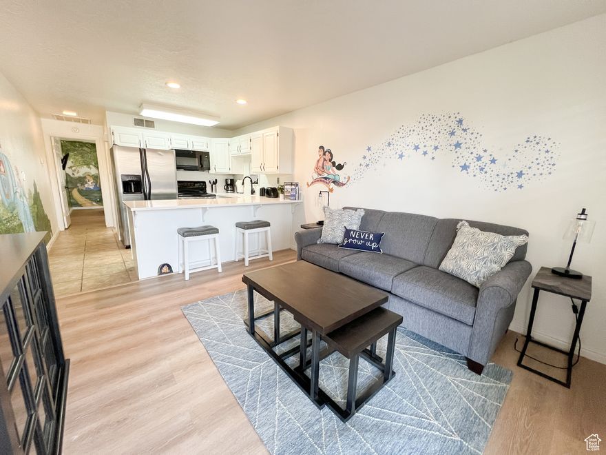 Fully Renovated Condo in Las Palmas Resort - Turnkey & Ready for you! This beautiful condo offers the perfect blend of modern comfort and resort-style living. Step inside to discover a completely updated interior featuring fresh paint, new flooring, and a contemporary kitchen with quartz countertops and stainless steel appliances. Custom Disney murals throughout add to the charm, making it bright and inviting. Whether you're looking for a vacation home, investment property (nightly rental approved!) this unit checks all the boxes. As part of Las Palmas Resort, you'll have access to multiple pools, hot tubs, a fitness center, sports courts, pickle ball and walking trails-all just minutes from golf courses, hiking, and downtown St George. Investor special! Seller is also selling #1423 and is willing to give a 'multi-unit' discount!