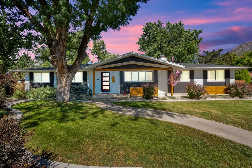 Welcome to this beautifully updated and inviting rambler in the heart of Holladay, offering exceptional indoor-outdoor living and thoughtful upgrades throughout. The main level features a bright, open layout with a stunning kitchen showcasing a large island, executive Wolf chef appliances, heated tile floors, and custom cabinetry-perfect for everyday living and entertaining. Enjoy cozy evenings by the fireplace and retreat to the expanded, fully updated primary suite. All bathrooms are custom finished, and natural light fills the home. The spacious basement provides excellent versatility with abundant storage, a gaming or entertainment area, kitchenette, and an additional fireplace-ideal for guests or extended living space. Outside, the backyard is designed for entertaining or relaxing with a covered patio, garden area, covered and city-permitted RV parking, and plenty of room to enjoy. Extensive updates include a recent renovation, new roof, exterior paint, trex deck, sewer line to the street, epoxy garage floors, tankless water heater, furnace, and air conditioner, along with custom closets and a gas hookup. Enjoy prime Holladay living near Cottonwood Country Club, the revitalized Holladay Village, and the future Spring Lane Park. Ideally located close to I-215, ski resorts in Big and Little Cottonwood Canyons, shopping, dining, and public transit.