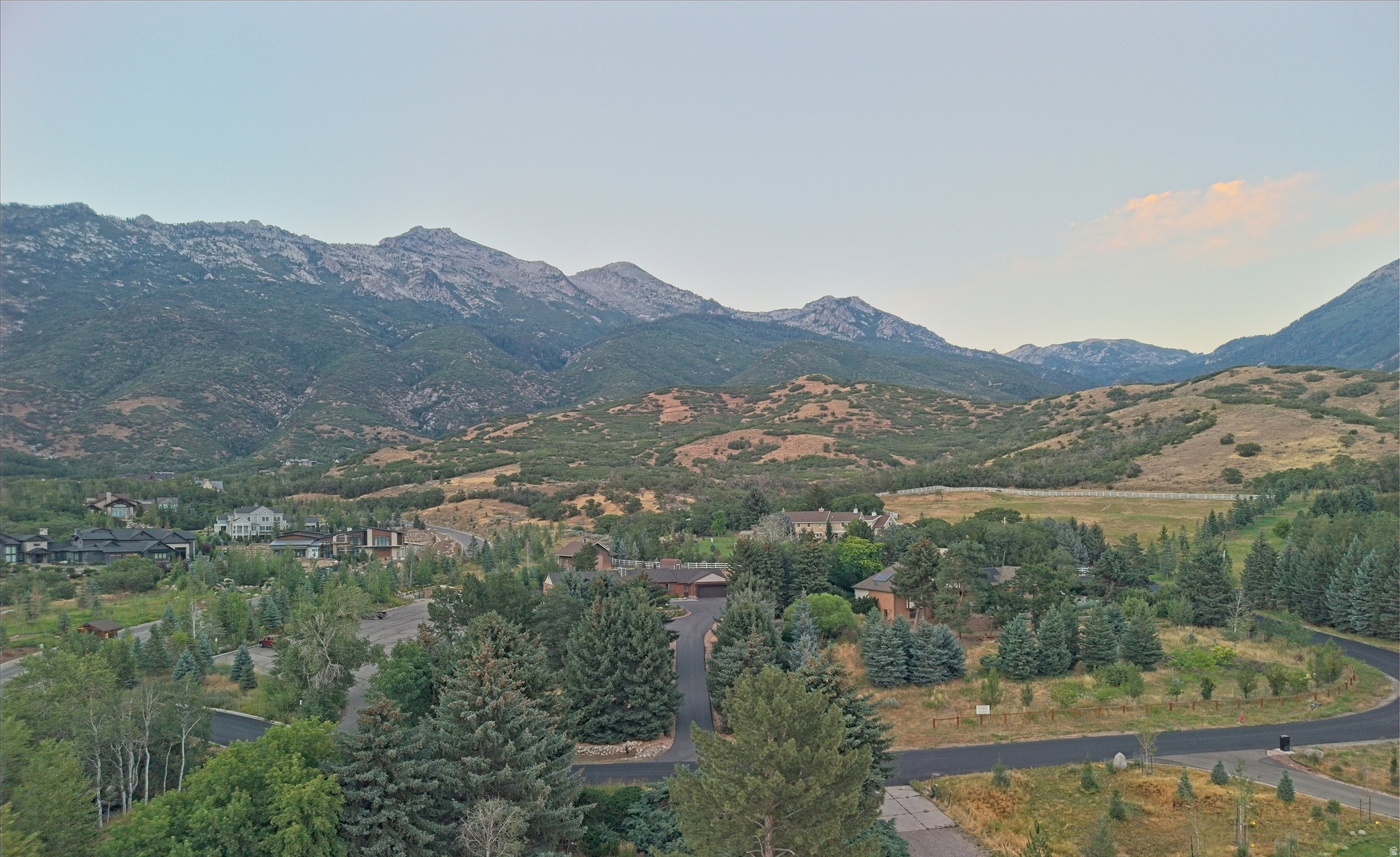 Expansive mountainous terrain with varied tree coverage