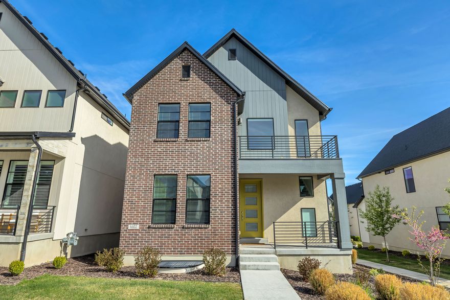 This beautifully designed home is filled with natural light and features a sleek, bright, and neutral interior that feels both modern and inviting. The kitchen is designed for both style and function, featuring a large quartz island, stainless steel appliances and plenty of cabinet space. With the refrigerator, washer, and dryer all included, this home is move-in-ready! Enjoy stunning views of the mountains from all four patios and easy access  to Mountain View Corridor, I-15, and 2100 N- just minutes from shopping, dining, parks, biking trails, and entertainment! This home offers a fantastic combination of comfort, style, and convenience.