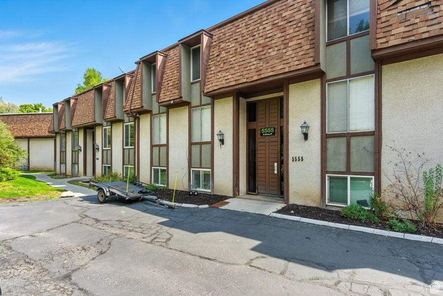 Incredible landscaped Community feels like a private Oasis all for you. This top-level unit features a Trex deck, newer windows, granite countertops, a cozy fireplace with a large mantel piece, a Galley Kitchen, one covered parking spot, and one shared 2-car garage.