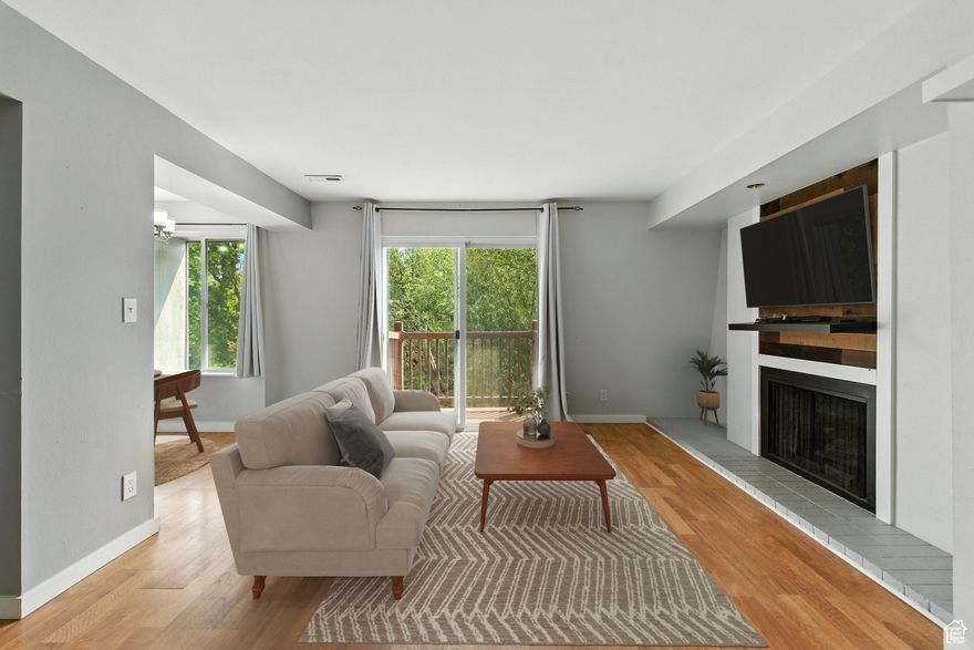 Incredible landscaped Community feels like a private Oasis all for you. This top-level unit features a Trex deck, newer windows, granite countertops, a cozy fireplace with a large mantel piece, a Galley Kitchen, one covered parking spot, and one shared 2-car garage.