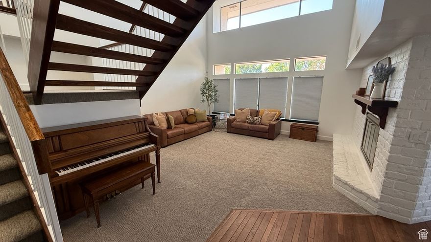 Nestled in a serene and friendly neighborhood, this anything-but-builder-basic home has awe-inspiring views from huge windows, perfect for watching hot-air balloons in the morning. Recently renovated, the interior radiates warmth and modernity, offering an inviting atmosphere. Large, numerous windows allow a flood of natural sunlight to illuminate every corner, creating a vibrant and cheerful ambiance. The heart of this home is its unique hand-laid red brick patio surrounding the front of the home, a perfect blend of elegance and charm, ideal for outdoor relaxation or entertaining guests. The home features three wood burning fireplaces to bring that cozy feeling to any get-together. The one-of-a-kind stairwell inside is not just a means to traverse floors but a statement piece of art, adding an exclusive touch to the home's character. Other highlights include spacious living areas, high ceilings, and comfortable bedrooms that serve as tranquil retreats. This property is not just a house, but a dream home waiting to be yours. Experience living in this beautiful St. George setting. Square footage figures are provided as a courtesy estimate only and were obtained from County records. Buyer is advised to obtain an independent measurement.