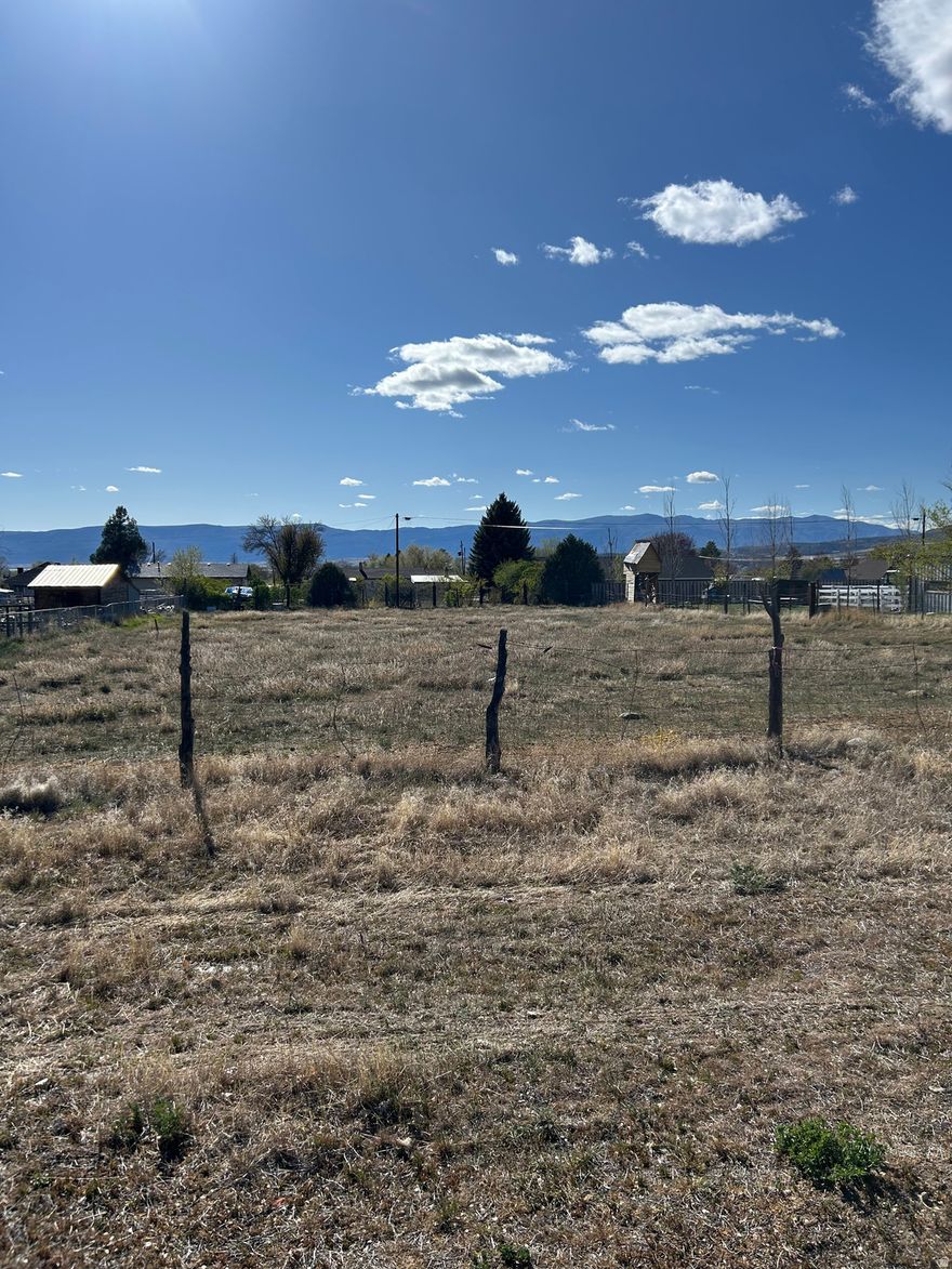 Beautiful 12 acre lot located in a desirable, well-established area. This property offers stunning views and the convenience of being close to schools, shopping, and the hospital-an ideal setting for comfortable everyday living. Irrigation water is available, providing added value and flexibility for landscaping or gardening. With its great location and attractive surroundings, this lot is the perfect place to build your dream home.