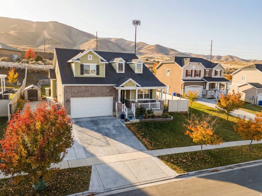 *No Backyard Neighbors, RV Parking & Fully Finished Basement* This three level home with mountain and lake views has 9-foot ceilings on both the main level and basement. The primary ensuite is on the main level. Kitchen features quartz countertops, farmhouse sink, custom hardwood cabinets, large island and a formal dining room. Large theater room, dedicated office, and lots of storage throughout the house. New carpet. Large back yard with pavilion, RV or boat parking, 220V hookup, and no backyard neighbors. Includes solar panels (paid off), two water heaters, and newer appliances.  Square footage figures are provided as a courtesy. Buyer is advised to obtain an independent measurement.