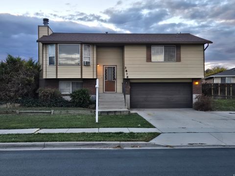 Photo of 3876 S BURNINGHAM DR W, West Valley City, UT 84119 (MLS # 2123447)