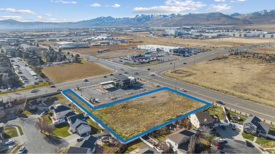 High-Exposure Commercial Development Site in Core West Jordan Growth Corridor. This 1.40-acre PC-zoned parcel represents a rare opportunity to secure commercial land in one of West Jordan's developing retail areas. Positioned directly off 5600 West, immediately north of Mountain America Credit Union, the site offers exceptional visibility, strong traffic counts, and proximity to nationally recognized anchors that continue to drive sustained consumer demand. With entitlement work underway and conceptual plans in place, this asset is ideally suited for an investor seeking near-term development execution or an end user looking to control a strategic long-term location. Future transit-oriented growth further enhances the site's upside, as a planned TRAX station at the southwest corner of 9000 South is expected to increase accessibility, foot traffic, and overall site value. Opportunities of this caliber, combining visibility, zoning flexibility, entitlement progress, and future transit adjacency, are increasingly scarce in the West Jordan market. Location Highlights:  Strategically positioned with high visibility from 5600 W  High traffic counts - 17,949 ADT on 9000 South  Surrounded by established tenants including Maverik, Arctic Circle, Home Depot, Smith's Marketplace, and MACU  Adjacent to a new UTA station planned at the southwest corner of 9000 South-adding future transit access and foot traffic. This is a rare opportunity to acquire a high-visibility development site in a rapidly growing commercial node of West Jordan.