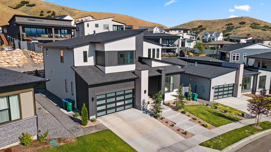 Introducing this stunning, designer-upgraded Toll Brothers residence in the highly sought after Traverse Mountain community of Lehi, Utah. Perfectly positioned near Silicon Slopes, Thanksgiving Point, and the area's premier shopping, dining, and entertainment, this home delivers far more than beautiful design it offers an exceptional lifestyle. From the moment you step inside, you're welcomed by an abundance of natural light streaming through oversized windows, accentuating the open-concept layout, wide-plank wood flooring, custom lighting, and high-end finishes throughout. Every detail has been thoughtfully curated to create a seamless blend of modern elegance and everyday comfort. The spacious living areas are designed for both relaxation and entertaining, offering a warm yet refined atmosphere. Clean and cohesive aesthetic carry beautifully from room to room, creating a sense of flow and sophistication across the entire home. Ideally located just minutes from major tech campuses, top-rated schools, and convenient access to I-15, this move-in-ready home presents a rare opportunity in one of Lehi's most desirable neighborhoods. Experience elevated living in Traverse Mountain. Square footage figures are provided as a courtesy estimate only and were obtained from county record.  Buyer is advised to obtain an independent measurement.