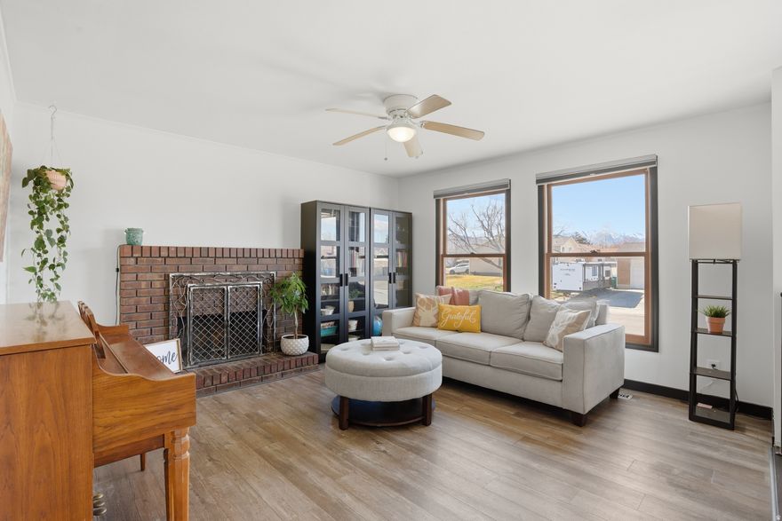 Updated Riverton Rambler with bonus backyard space for garden (already planted), sheds, toys, RV and extra vehicles. Owners have created a Garden of Eden that will come to life in a few months: 60 herbs, grapevines, flowers and trees of many varieties. Gazebo plus huge trex deck. Inside: 3 bedrooms on main w/ 2 living rooms and kitchen, eat in dining and entry to large back deck; (split entry home) downstairs: 2 beds & 1 office/den/game room in basement. All new carpet in basement. Newer laminate on main floor. New paint all throughout the home. New quartz countertops in the kitchen. Home is bright with shades that pull up or down, so you can keep privacy and still get sunlight. This home offers an additional second large living room in the back of main floor. Bonuses: Wood burning fireplace, garage attached shelves & cabinets, 2 large sheds. Room for toys, trampoline, volleyball, gardening and BBQ.   Square footage figures are provided as a courtesy estimate only and were obtained from a prior appraisal measurement. Buyer is advised to obtain an independent measurement.