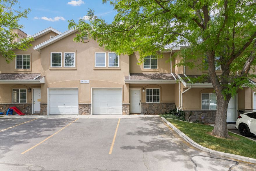 Tucked inside a gated community near the border of West Jordan and Midvale, this well-maintained townhome offers the perfect blend of convenience, comfort, and low-maintenance living. Ideally located just minutes from freeway access, Topgolf, RiverWalk's vibrant dining and retail district, Bingham Junction Park, and the growing Bingham Junction corridor, the location makes commuting and enjoying the area effortless. The home is also just moments from the Jordan River Trail, offering miles of scenic walking and biking paths for those who enjoy an active lifestyle and easy access to the outdoors.  Inside, you'll find a bright and functional layout with generous natural light, spacious bedrooms, and a kitchen that flows seamlessly into the main living areas, creating an inviting space for both relaxing and entertaining. The home features 3 well-sized bedrooms, 2 full bathrooms, attached 1-car garage, two designated parking spaces, and in-unit laundry for added convenience. There is also the potential to add an electric vehicle charger in the garage.  The community is designed for easy living and offers playgrounds, basketball courts, pavilion areas, and beautifully maintained grounds, allowing you to spend more time enjoying life and less time worrying about maintenance. Families will also appreciate the nearby elementary school and the new pedestrian bridge currently being built, designed to provide safer and more convenient access for children walking or biking to school. Whether you're looking for a comfortable place to call home or seeking a simplified lifestyle without sacrificing location, this townhome delivers exceptional value in one of the valley's most convenient areas.