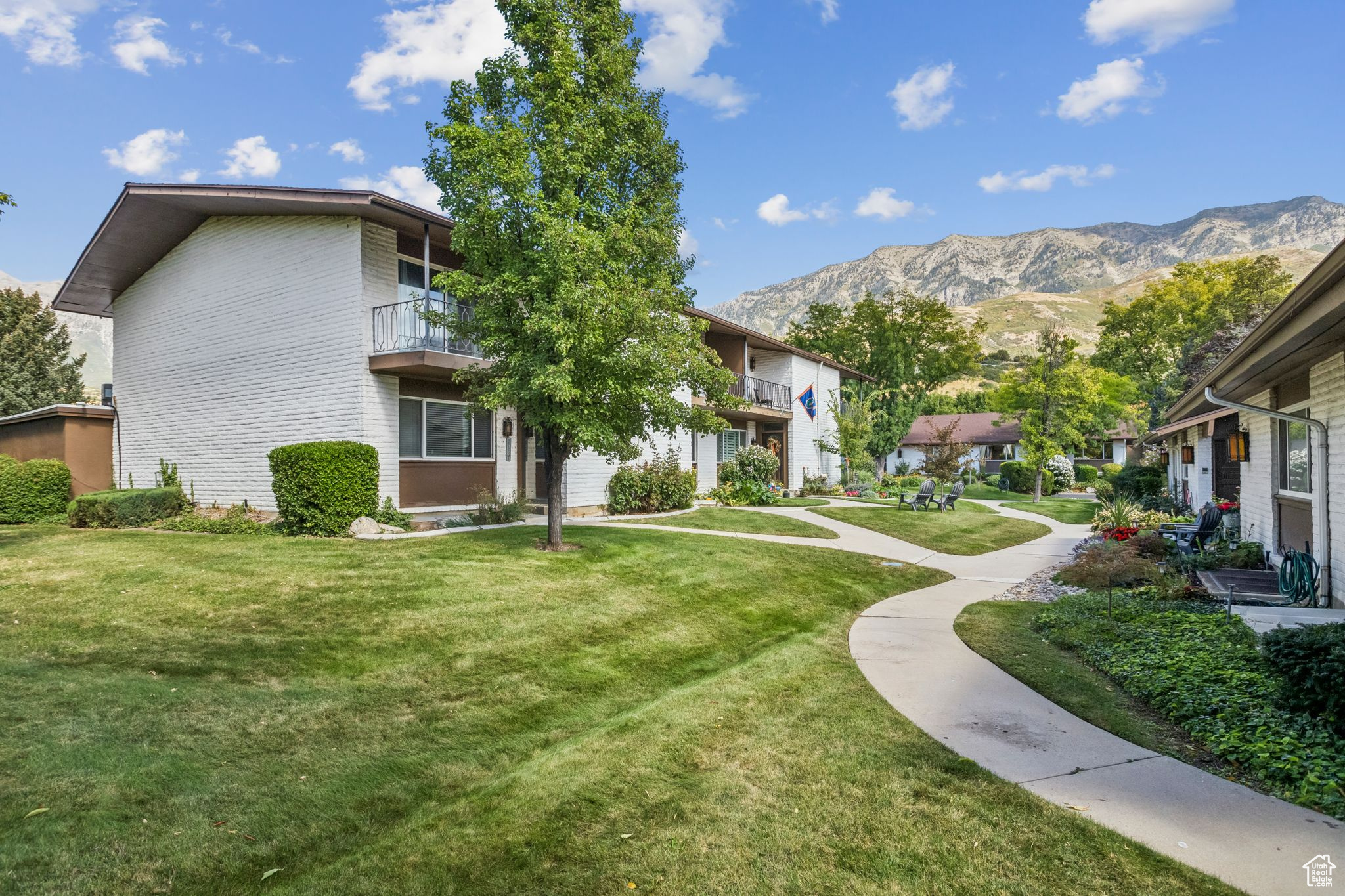 Discover this inviting condo perfectly situated near shopping, dining, and entertainment, with convenient access to both Brigham Young University and UVU. The home features an updated kitchen with sleek stainless steel appliances, along with durable laminate and tile flooring throughout. Enjoy gorgeous mountain views from multiple rooms, beautifully maintained landscaping, and a spacious backyard area ideal for entertaining or relaxing outdoors. With two dedicated parking spots included, this condo combines comfort, convenience, and lifestyle in one great package.