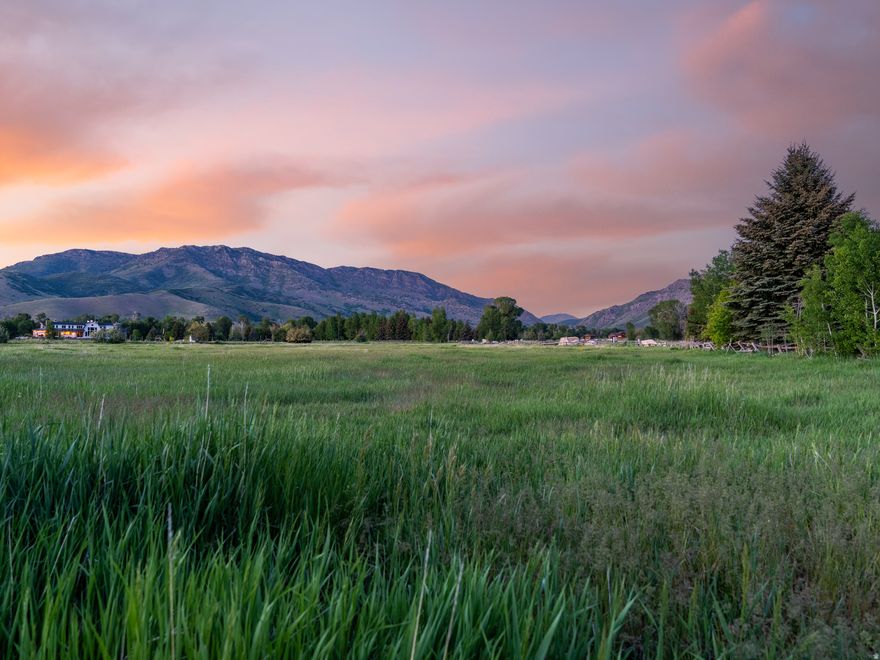Situated above the serene landscapes of Ogden Valley, this exceptional 5.25-acre estate parcel offers sweeping panoramic views-from the rugged peaks of the Wasatch Range and the ski runs of Snowbasin Resort to the lush, meandering beauty of Southfork Canyon. Set within the coveted River Ranch community, one of Huntsville's most exclusive and private luxury enclaves, this homesite seamlessly blends natural tranquility with the refinement of a legacy estate setting. Whether you imagine an elegant mountain retreat, a spacious family compound, or a sophisticated horse property, this land presents an extraordinary canvas for your vision. Featuring gentle topography, generous acreage, and a setting that feels both expansive and intimate, the parcel offers truly unmatched potential. Step outside and enjoy immediate access to world-class recreation: ski at Snowbasin, Powder Mountain, or Nordic Valley; boat, paddle, or fish at Pineview and Causey Reservoirs; tee off at nearby Wolf Creek Golf Course; or explore miles of trails by foot, horseback, or bike. Surrounded by pristine wilderness yet only minutes from modern conveniences, this is a rare opportunity to claim a private piece of paradise in Northern Utah's most treasured valley.. All property information, boundaries, and documentation to be verified by buyer.
