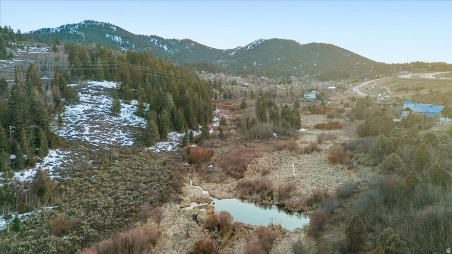 Incredible, rare, 2-acre site straddling a flowing stream and a beautiful pond backing mountain trails and access to it all! With no HOA this private one-of-a-kind lot provides the perfect oasis for a custom home build of your choice that is surrounded by nature, yet close to it all. All of the difficult and expensive work to get this property build-ready has been done! Contact agent for more details!