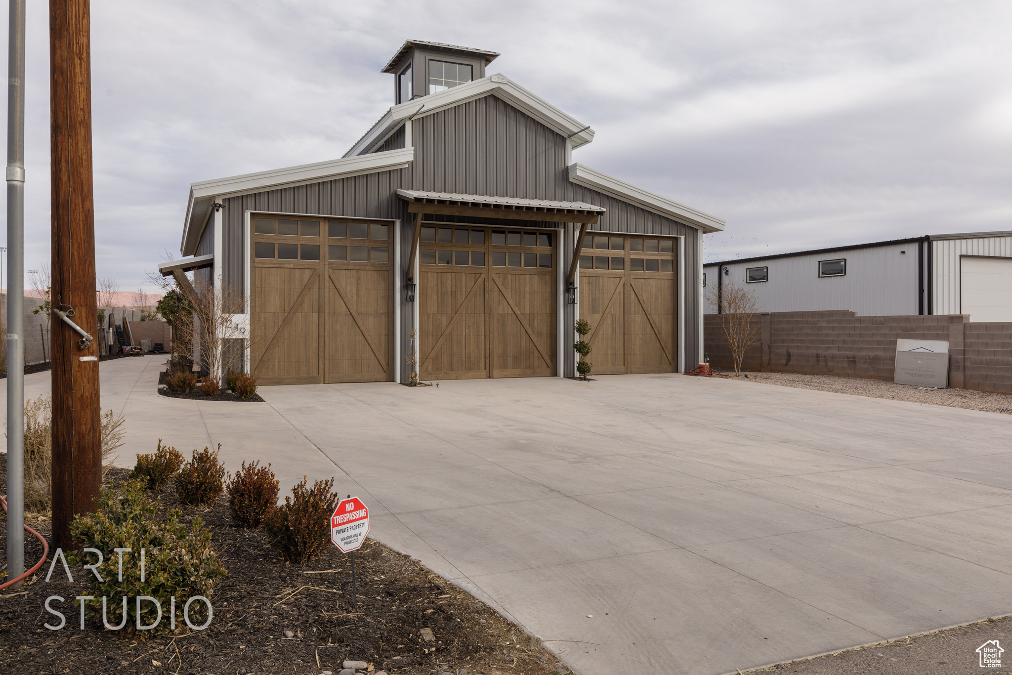 Situated just a stone's throw away from the city park and pickleball courts, this .50-acre agricultural gem offers the ultimate blend of rural serenity and urban convenience. After a day of outdoor fun, retreat to your expansive 7,000 square foot barn completed with temperature controlled duel fuel units. barn, the perfect spot for storage or transforming into your dream man cave. Whether you're a nature enthusiast, animal lover, or hobbyist, this versatile space offers endless possibilities. Seize the opportunity to create your ideal lifestyle in this idyllic location!'' The contemporary quarters are defined by elegance, with sleek finishes, a gourmet kitchen, beautifully appointed bathroom, and ample space bathed in natural light. Attention to detail is evident in every corner, from the  stately beams to the large windows framing the outdoor sanctuary. Outside, indulge in the meticulously landscaped grounds, complete with a tranquil water feature, flourishing raised garden beds, an expansive lawn, and a covered patio for family gatherings. Whether you desire tranquility or the perfect spot to gather with friends, this unique property captivates with its versatility and charm. Your exclusive man cave/toy garage/storage unit/gardening awaits, offering the perfect balance of comfort, style, and utility.