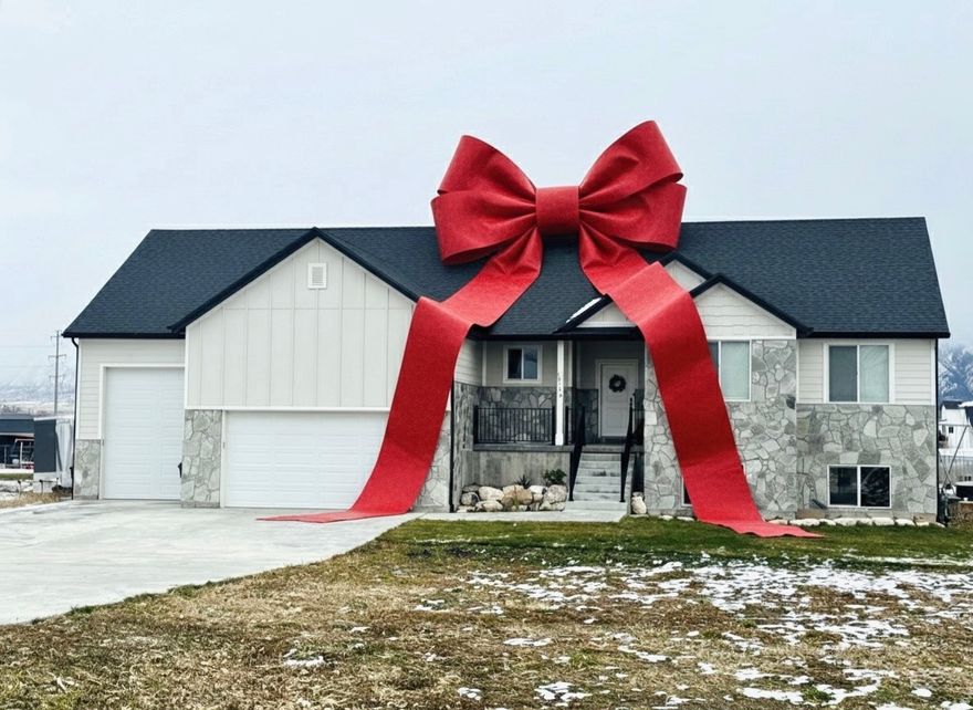 Escape the city with this beautiful home on 1.5 acres! Enjoy country views while still being less than 5 minutes from grocery stores and I-15. You'll love having no power bills for 90% of the year with a paid-in-full, whole-house solar system and battery backup. Reliable fiber internet is also run to the home. Inside, you'll find vaulted ceilings and an open layout that feels bright and inviting. Step outside of this west facing home to a spacious covered deck and large back patio. The oversized third-car garage could easily fit an RV. A separate entrance to the basement through the garage offers potential to create an ADU. The property has a large garden and orchard area with tons of open space for chickens, goats, horses, or whatever you can imagine. Includes 1 culinary water share from West Corrine Water. This home is priced to sell. Come take a look!