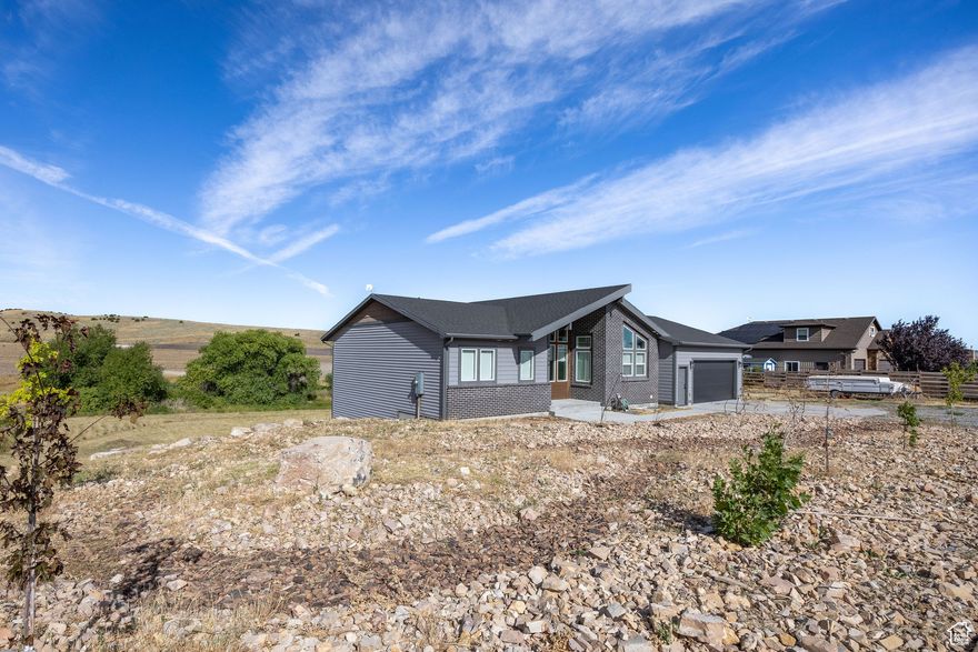 Price Reduction! Absolutely stunning four-bedroom, three-and-a-half-bath custom home on 1.24 acres with breathtaking mountain and valley views. Featuring two luxurious primary suites, this immaculate property is truly a slice of paradise. Bring your horses and enjoy the perfect blend of comfort, elegance, and country living