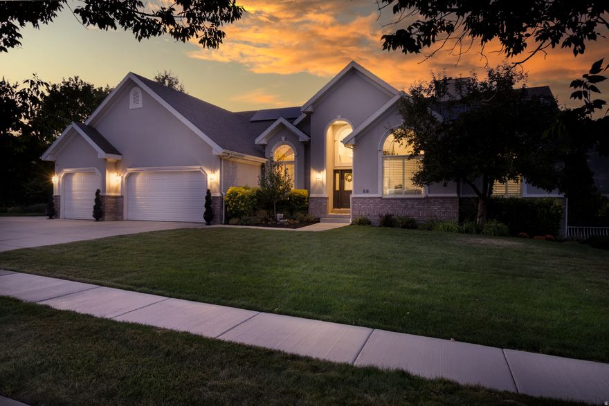 Welcome to Alpine living at it's finest. Walk in the front door and you are met with soaring ceilings and majestic views of Alpine City below and the mountains above. This amazing view is unobstructed from either of the two large  covered decks across the back of your new home.  Dining, entertaining or just sitting together and relaxing, your evenings here hold a special enchantment.  Main floor features include formal living room with a gas fireplace, dining room, kitchen, family room, primary suite with bath,  plus two more bedrooms, laundry and another full bath. Lower level  features 9 1/2 foot ceilings, large living room with fireplace, four bedrooms, bath, a studio and so much storage you'll be looking for more stuff just to fill the space.  Now for the best part; the solar system is fully owned and results in an average electric bill of $18.50/month  Square footage figures are provided as a courtesy estimate only and were obtained from a prior appraisal .  Buyer is advised to obtain an independent measurement.