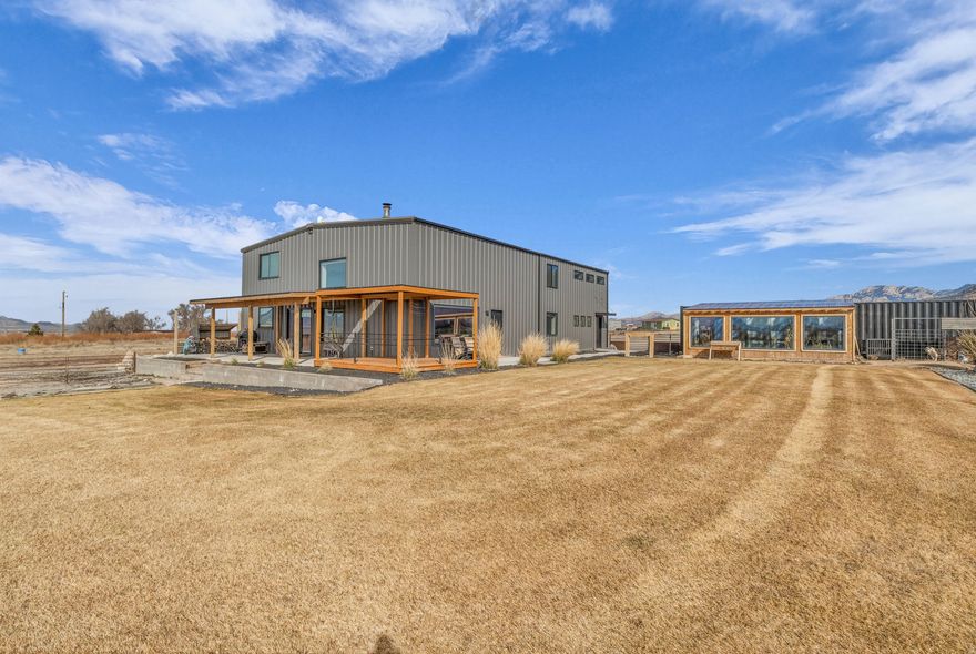 The perfect blend of luxury and country living with this beautifully designed modern barn-dominium set on 14 expansive acres. Thoughtfully crafted with high-end finishes throughout, this home features soaring ceilings, oversized windows, and an open-concept layout that captures breathtaking views from every angle. The sleek, modern design offers both style and functionality, creating light-filled living spaces ideal for everyday living & entertaining. Outside, enjoy wide-open land with room to roam, garden, or expand. Complete with a greenhouse for year-round growing. Oversized garage provides ample space for vehicles, toys, equipment, or workshop, . This rare property delivers privacy, space, & versatility- perfect for those seeking refined country living without sacrificing modern comfort.