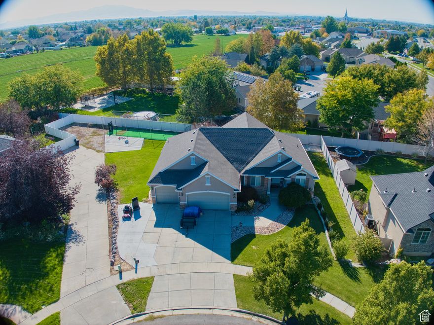 OPEN HOUSE!! SATURDAY, NOVEMBER 29TH, 11-1! Welcome to this home nestled in a serene cul-de-sac in the heart of Syracuse. This exquisite home is just minutes from schools, dining, shopping, entertainment, and has  effortless access to Highway 177. This home features an oversized basement family room for all your indoor entertaining, RV pad, a plumbed hot tub-ready pad, covered backyard deck, and a private batting cage, creating a residence that perfectly balances the busyness of everyday life with the opportunity for luxurious lifestyle amenities without an HOA. The spacious backyard deck has ample storage underneath, ideal for maintaining a pristine outdoor retreat. The oversized third car garage is perfect for professional workers and hobbyists alike. Home is generator ready as well. Schedule a tour today! Square footage figures are provided as a courtesy estimate only and were obtained from an appraisal.  Buyer is advised to obtain an independent measurement.