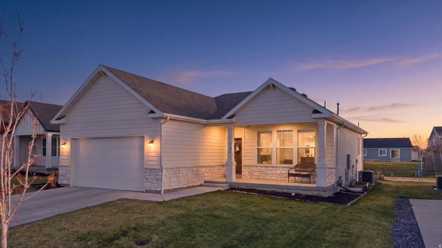 Welcome to this naturally light and bright, near-new home with plenty of upgrades!  Ideally situated in a wonderful community on the west side of Smithfield, this charmer features LVP flooring, a white kitchen with quartz countertops, a tiled backsplash, stylish fixtures, and all appliances are included (even the washer and dryer). The open floor plan includes a gas fireplace, a large dining/living area, main level laundry, 3 bedrooms, and 2 baths.  The unfinished lower level offers plenty space for expansion.  Fully landscaped yard with custom flower boxes, and a premium lot that backs up to green space and the disk golf course. Community includes a pool, park, and pickleball courts. Don't miss this gem!