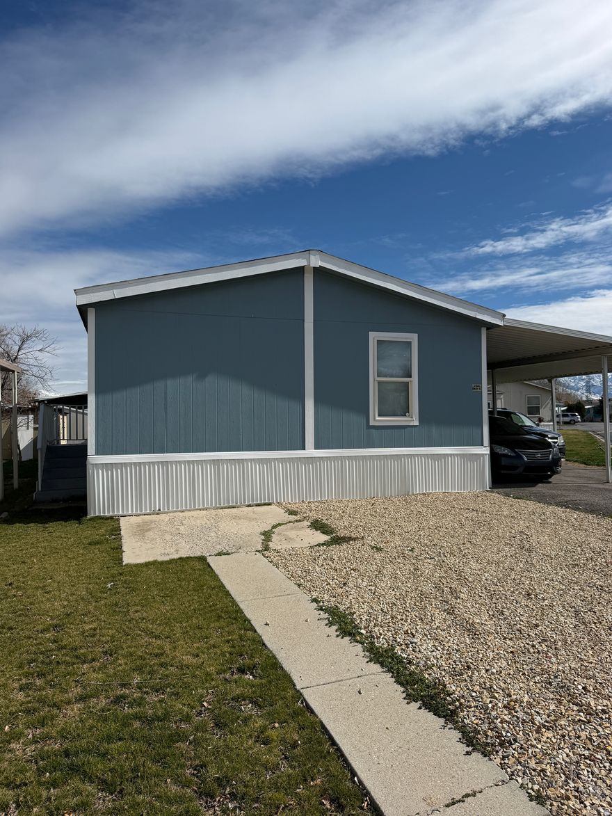 Spacious mobile home located in a highly convenient area with quick access to I-215 and Bangerter Hwy, making commuting easy. The property is also just minutes from Valley Fair Mall, with nearby shopping, dining, and everyday amenities. The home features a new A/C unit installed in August 2025, which includes a 5-year warranty, providing added comfort and peace of mind. For showings, please park in the designated visitor parking area or in the carport. Avoid parking on the street as vehicles may be subject to towing. Visitor parking is available until 6:00 PM. Appliances included: washer, dryer, and refrigerator. Square footage figures are provided as a courtesy estimate. Buyer and Buyer's Broker are advised to verify all information. $1,078 monthly lot rent. Buyer's water, storm water, trash, sewer, and city taxes are billed separately and are subject to change based on usage and municipal adjustments. Lot rent is also subject to change. Please contact the park for current rates and details.