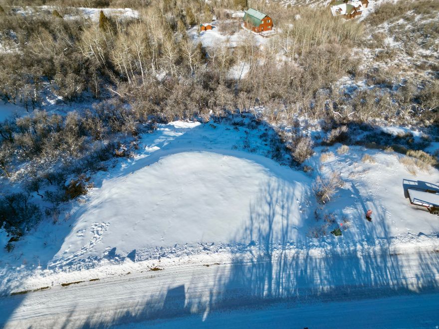 Perched above the valley in the highly sought after Timberlakes community, this incredible lot delivers the kind of views people come to the mountains for panoramic, unobstructed vistas of Mount Timpanogos and the entire Heber Valley. This is the ideal setting to build your dream mountain home, offering the perfect balance of privacy, natural beauty, and accessibility.The groundwork has already been started for you, with $30,000 invested in a rock and gravel for the driveway and garage area, plus an approved perc test in place making this a truly build ready opportunity. If you've been waiting for the right lot with the right views in Timberlakes, this is it.