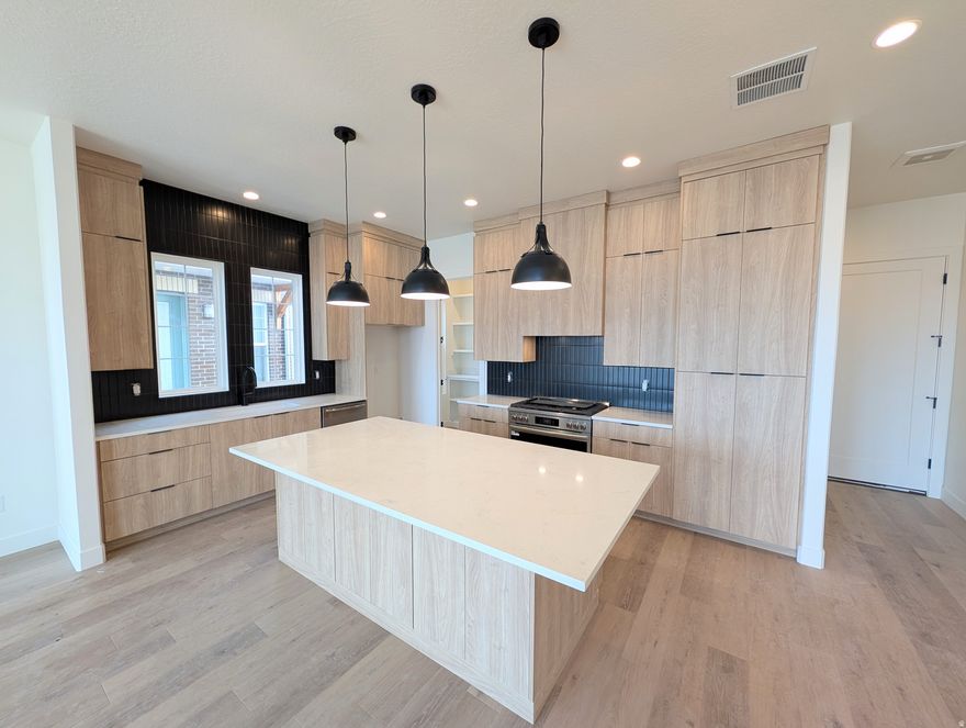 Stunning Waterfront Home with Rentable ADU (apartment above the garage) and Spacious 3-Car Garage. Discover the perfect blend of versatility, comfort, and waterfront living with the brand-new Birmingham floorplan. This thoughtfully designed home offers an expansive layout, ideal for modern living and entertaining. The main living area is crafted for seamless indoor/outdoor living, featuring sliding doors that open to a spacious porch for for enjoying the views along the waterfront. For those who love to cook, the home includes a large walk-in pantry, offering plenty of storage. The Primary bedroom features an upper deck with a pergola, providing a serene retreat. The standout feature of the Birmingham plan is the attached Accessory Dwelling Unit (ADU), offering endless possibilities-whether it's for rental income, a dedicated guest suite, or an extended living space. Current list price is a FINISHED ADU, along with the premium waterfront lot and designer upgrades and options! *$10,000 Preferred Lender Incentive towards rate buy down/closing cost!