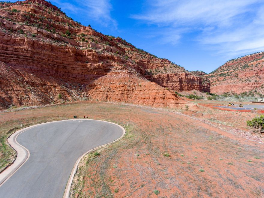 Improved Lot nestled in the final phase of the premier development of La Estancia, this lot brings huge views of the red rocks of Kanab's Vermilion Cliffs in a 360' settling. You can see right up Tom's canyon that leads to the plateaus above that can easily be reached through the hiking/biking trails in the community. Bring your dream home plan and preferred builder, and build on your own time frame.  You are close to three National Parks, Zion, Bryce Canyon and the Grand Canyon North Rim! And for those of you who love the water, Lake Powell is 70 miles away.
