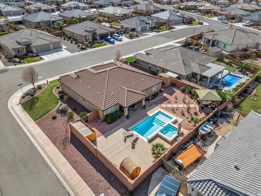 Welcome to your private desert oasis in the highly desirable Sugar Plum community. This beautifully designed home features vaulted ceilings and an open concept living room and kitchen filled with natural light. The resort style backyard is a true retreat with pool, hot tub, sauna and pergola surrounded by easy maintenance desert landscaping. Enjoy a 3 car garage with mini split system and epoxy flooring. With seamless indoor/outdoor living and exceptional upgrades throughout, this home offers the ultimate desert lifestyle.