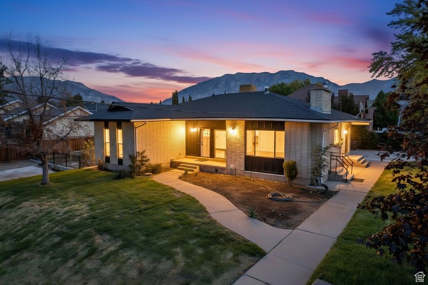 Welcome to this beautifully remodeled Provo home with a modern open-concept design. The spacious main living area is perfect for entertaining, highlighted by stylish finishes, a sleek kitchen with custom cabinetry, and abundant natural light. The fully finished basement includes a private one-bedroom, one-bathroom apartment with its own exterior entrance, making it ideal for rental income, guests, or multigenerational living. From the property, you can enjoy stunning mountain and lake views, while the large backyard offers a blank slate to create your dream outdoor space. A generous patio is perfect for gatherings, and the ample off-street parking provides plenty of room for cars, RVs, and outdoor recreation vehicles. This move-in ready home combines modern comfort, flexible living options, and unbeatable views in one desirable Provo location. Square footage figures are provided as a courtesy estimate only and were obtained from County Records. Buyer is advised to obtain an independent measurement.