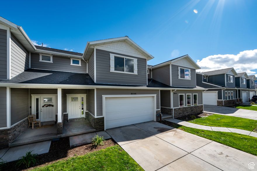 UPDATE! BRAND NEW CARPET INSTALLED 10/30/25. ALL APPLIANCES NOW INCLUDED IN PRICE, INCLUDING WASHER/DRYER & REFIGERATOR!  New water heater installed in 2025!  $5,000 Seller paid concessions! This 4 bedroom, 2.5 bath townhouse is  PRICED TO SELL QUICK!  On the border of Saratoga Springs/Eagle Mtn. Conveniently located near Pony Express Rd & Close to Ridley's shopping area.  Open grassy area behind the property, with a daylight walkout basement. LVP flooring on the main level, granite countertops, gas stove, white cabinets 9ft. ceilings on the main, extremely large owner's suite room, bathroom and closet,  Coat closet, linen closets, and an amazing laundry room.  Additional living space in this daylight walk out basement. Seller is also including a 1 year Home Warranty at closing up to $700.  This home will not last at this price. Come and see us today!