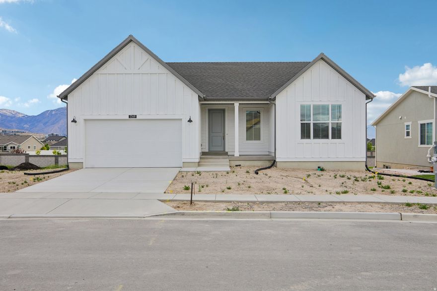 New rambler by Ivory Homes located in Holbrook Farms in Lehi, offering 3 bedrooms and 2 bathrooms with an open, practical layout. The home features modern finishes and solid craftsmanship throughout. An unfinished basement provides the opportunity to add bedrooms, a bathroom, or additional living space. Situated on a lot with clear, unobstructed mountain views. Comes with a 1-year builder warranty. Convenient access to nearby schools, shopping, and major commuting routes.