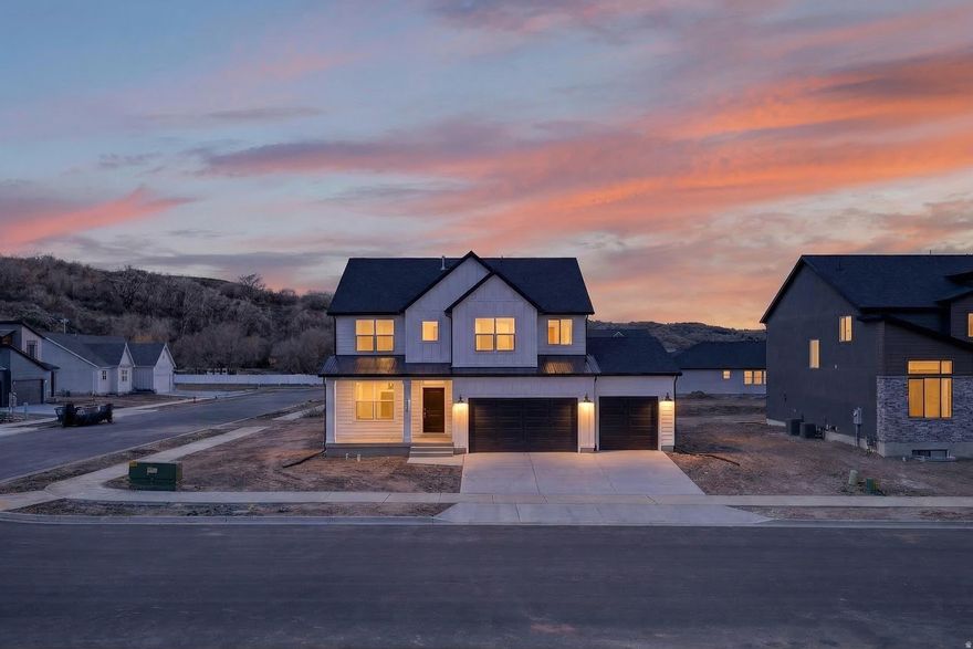 Take advantage of a limited-time rate promotion with our preferred lender: **4.99% on a 30-year fixed FHA/VA loan or a 7/1 ARM.** Welcome to Riverwood in South Weber! This thoughtfully designed Rainier floor plan offers 4 bedrooms and 2.5 bathrooms with modern finishes throughout. The spacious great room, accented by a cozy fireplace, creates the perfect setting for relaxing evenings or slow mornings with a cup of coffee. The kitchen features quartz countertops, and flows seamlessly into the main living area-ideal for everyday living and gathering with friends and family. Multiple living spaces throughout the home provide flexibility for work, and play. Downstairs, the unfinished basement offers the opportunity to expand and truly make the home your own. Additional highlights include a convenient mudroom/drop zone and an oversized 3-car garage with plenty of room for storage, gear, or hobbies. Located just minutes from local favorites like Burly Burger and with easy access to Riverdale Rd, HAFB, I-84, and Hwy 89, commuting and daily errands are simple and convenient. A great opportunity to own in one of South Weber's most desirable communities.