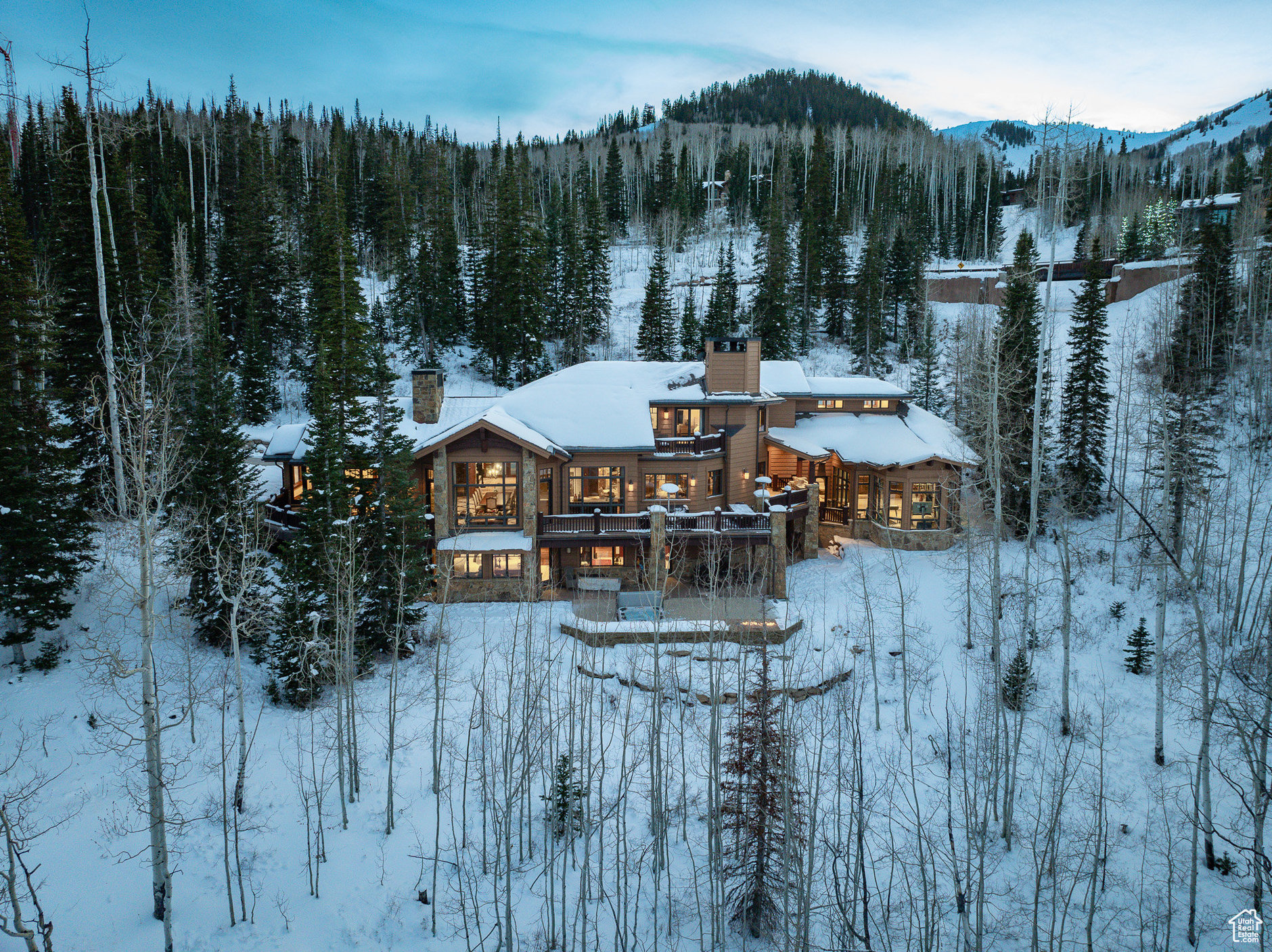 Within the exclusive, private community of The Colony at White Pine, this extraordinary estate redefines living where privacy is paramount. Interior design by the incredible Paula Berg, architecture by the renowned Rick Otto, and impeccable construction by Don Craig, this architectural masterpiece offers a seamless blend of elegance, simplicity, and functionality. Spanning 5.18 acres, this ski-in / ski-out residence boasts 6 bedrooms and 9 bathrooms, providing ample space for family and guests. The thoughtfully designed layout includes multiple gathering spaces, an indoor swimming pool for year-round enjoyment, a well-appointed ski room to support all-mountain adventures, formal dining room, multiple wine rooms with bottle lift, expansive great room, and kitchen area ideal for intimate and grand entertaining, theatre room, 3 car garage, outdoor jacuzzi and multiple fire pits, fitness area, and countless architectural details showcasing the highest standards of craftsmanship and design. This estate is located on the Middle Crowning Glory ski run at Canyons Resort, Park City. Every detail, from the custom craftsmanship to the seamless layout, reflects an unparalleled commitment to quality and design.  This estate is more than a home; it's an experience of refined living in one of Park City's most exclusive communities.