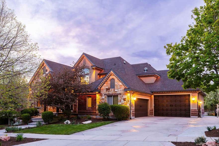 This 2002 Parade of Homes entry by Peterson Homes showcases timeless design, quality craftsmanship, and custom woodwork throughout. Featuring an open and functional floor plan, the home boasts generous living areas filled with natural light, a well-appointed gourmet kitchen ideal for entertaining, and spacious bedrooms designed for relaxation. The extra-large primary suite serves as a true retreat, offering ample space, comfort, and privacy. The fully finished walk-out basement adds versatility and convenience, complete with a dedicated theater room-perfect for movie nights, game days, and entertaining guests in style. Step outside to your own private backyard oasis featuring a stunning Dolphin Boulderscape Grotto saltwater pool and hot tub, creating a true resort-style experience ideal for relaxing, entertaining, and enjoying peaceful, secluded surroundings. Car enthusiasts and hobbyists will love the rare 6-car garage, offering abundant space for vehicles, storage, and recreational gear. Located in a quiet, desirable neighborhood within the highly sought-after Corner Canyon High School boundaries, you're just minutes from top-rated schools, parks, hiking and biking trails, and convenient shopping and dining. With easy access to both Salt Lake and Utah County, this home combines peaceful suburban living with unbeatable convenience.