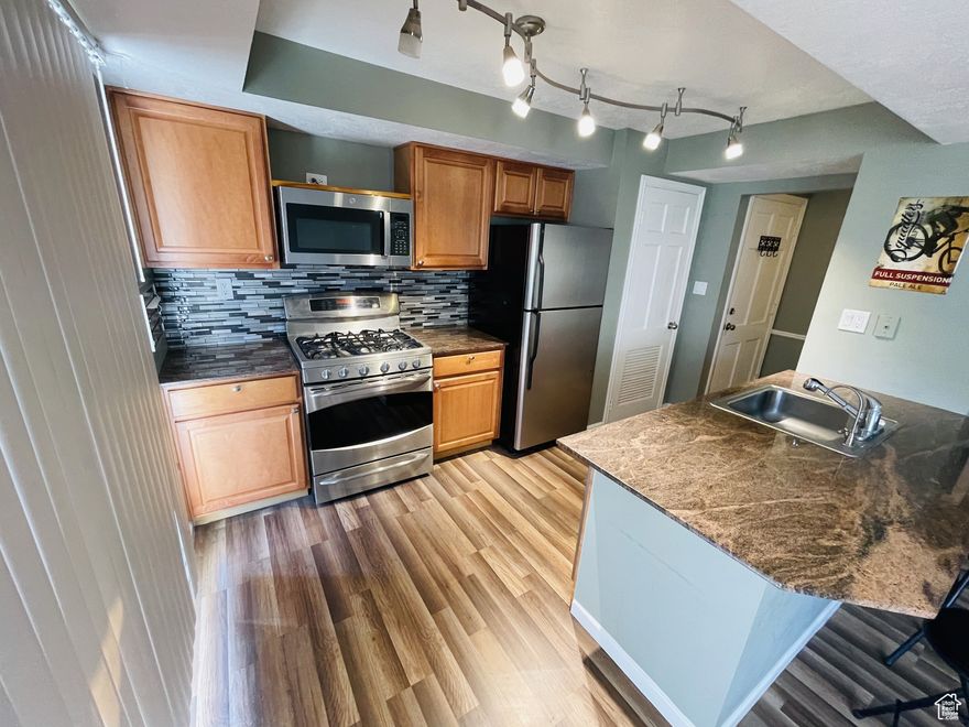 Mid-floor condo in Aix La Chapelle located in the Heart of Holladay. Heat, A/C, gas & water-sewer included. Enjoy nearby community amenities - restaurants, shops, library, parks, and more. Open floor plan, spacious bedroom, updated kitchen, laminate flooring, dedicated storage. The building features laundry facilities, two pools, sauna, gym, bike racks, and reserved covered parking. Perfect for outdoor lovers with hiking, biking, skiing nearby. Owner-occupied, with guest parking available. Embrace a vibrant lifestyle in this prime location! Must be owner-occupied.