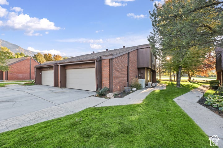 Brick exterior with brown siding accents