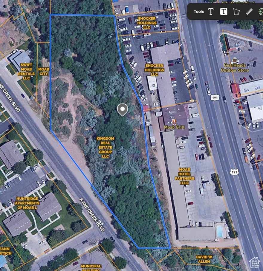 Beautiful setting amongst trees along Pack Creek.  Building envelope of .60 acres sitting on 2.25 acres of scenic property, facing the Moab Rim.  Previously approved for 9 townhomes, could also be zoned for commercial use.  Car Wash, Restaurant, Coffee Shop, Motorsport/bike rentals, recreational equipment rentals, are some of the potential uses. Survey, topo report, & Scour Report all available upon request