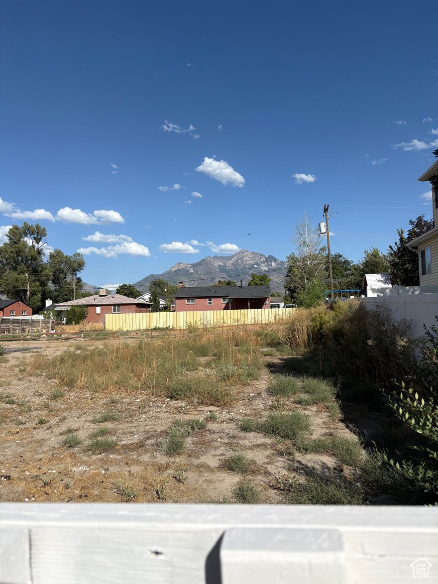Brand new building lot now available.  Flat lot, mountain view.  Driveway at end of cul-de-sac.  Water and sewer are stubbed to the driveway.  Electric pole on the east side of the property. Nice area in Sandy, close to Trax, schools, recreation!