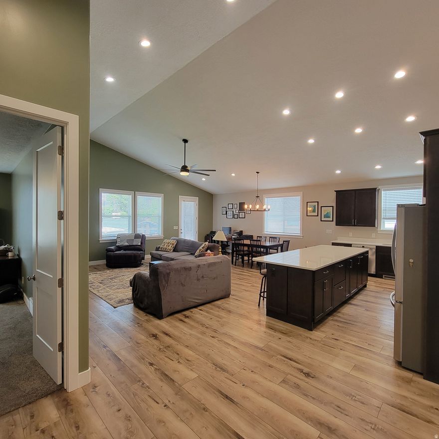 Better than new and move-in ready without the wait.  Completed in 2024, this beautifully finished rambler offers over 3,800 sq ft of thoughtfully designed living space with the upgrades today's buyers actually want. From the moment you step inside, you'll notice the difference: an open, light-filled layout, quality finishes throughout, and a home that feels solid, efficient, and comfortable year-round.  The main level features a spacious great room (approximately 14' high peak), a well-appointed kitchen with quartz countertops, giant island (10' x 3 1/2') and a functional layout perfect for both everyday living and entertaining. The finished basement adds incredible flexibility with additional bedrooms, a large living area, and space for a home gym, office, or hobbies.  What truly sets this home apart is its efficiency and comfort. Built with a tight building envelope, an energy recovery ventilation (ERV) system, and a high-efficiency dual-zone furnace and A/C system, you'll enjoy consistent temperatures on both levels and lower utility costs compared to typical homes.  The oversized garage is another standout feature, offering an extended bay ideal for trucks, extra storage, or workspace.  Outside, the yard is mostly finished and ready to enjoy, with just minor areas left for you to customize to your taste, giving you the benefits of a finished yard without paying a premium for someone else's design choices.  Currently no HOA. However, an HOA is being formed for the community and homeowner will be required to join. Full details To Be Determined. Please contact agent with any questions.  Why wait or pay extra for a new build when this home already includes the upgrades, finished basement with 8' high ceilings, and move-in readiness you're looking for!  Located in a quiet, established neighborhood with convenient access to shopping, schools, and commuter routes, this home offers the perfect balance of comfort, efficiency, and value.  Come see the difference for yourself.  Equal Housing Opportunity