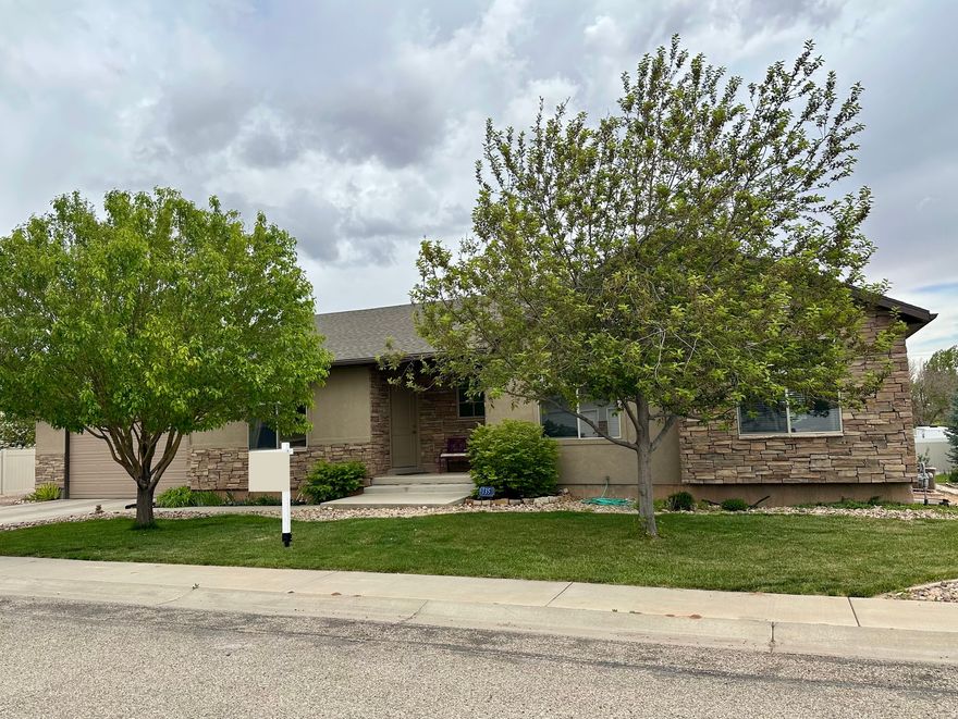 Living is easy in this spacious home and quiet and friendly neighborhood. Stay active with a park and walking trail close by. Fully landscaped yard offers shade in the evening with space to grill and chill. Garden spot with established raspberries and apricot tree. Basement is perfect for guests, kids, or grandkids with spacious bedrooms and a bathroom. Basement family room has room for a pool table or exercise equipment and is plumbed and wired for a future kitchenette. Main level has large, open floor plan for entertaining and relaxing. Laundry is also on main floor. Simple and easy floor plan that is understated and beautiful as is, or ready for your personal touches and style.