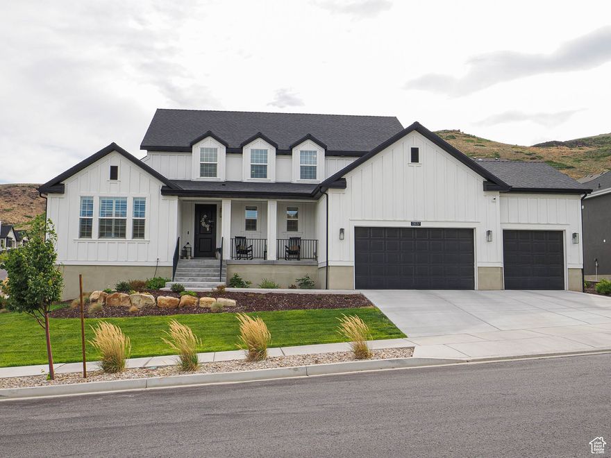 Welcome to this meticulously crafted luxury residence perched on a beautifully landscaped corner lot in sought-after Herriman. With breathtaking, uninterrupted views of the Salt Lake Valley, this home offers high-end living across three fully finished levels with thoughtful design and premium finishes throughout.  The main level features soaring 20-ft lofted ceilings, a striking catwalk, and expansive open-concept living. The heart of the home includes a chef-inspired kitchen with custom wood-wrapped hood vent, matte honed 2" quartz countertops, a breakfast nook, formal dining room, and a spacious great room. The dedicated home office with coffered ceiling adds both function and elegance. The owner's suite is a true retreat with a soaker tub, stand-up shower, and double vanity. Also on the main level: a half bath, full laundry/mudroom, and 99-inch doorways throughout for an elevated sense of space. The fully finished basement boasts 10-ft ceilings, dry cold storage a large living/rec area, two bedrooms, a  bath, and three versatile storage rooms. A basement bedroom includes a secondary en-suite bath, making it ideal for multi-generational living. Additional features include:  Extended 3-car garage with 18-ft single bay extension  Lofted garage storage system + outdoor shed with loft  Brand new Nuvo Manor water filtration & softening system  Dual-zone HVAC, recessed lighting throughout, and Ivory Homes 10-year extended structural warranty. This home combines timeless design with modern luxury, all set in a prime location with unmatched views. Schedule your private showing today and experience Herriman luxury living at its finest.