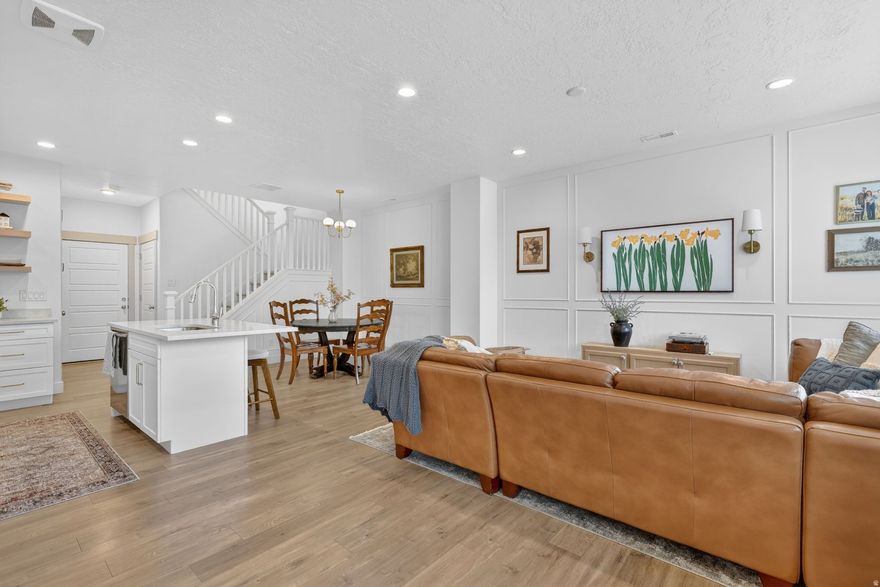 This beautifully designed 4-bedroom, 3.5-bath townhome in Daybreak's Heights Park neighborhood checks every box. Thoughtful and tasteful design choices throughout give the home a polished, move-in ready feel - from the main living areas all the way down to the fully finished basement, every inch of this home has been done right. Step outside onto your private balcony or relax on the patio. The location makes it even better, sitting right across the street from parks and just a short walk to Downtown Daybreak, Soda Row, Oquirrh Lake, and Bees Stadium. Whether you're a first-time buyer or looking to downsize without sacrificing style, this one is hard to pass up - come see it before it's gone! Square footage figures are provided as a courtesy estimate only and were obtained from county records.  Buyer is advised to obtain an independent measurement. Buyer to verify all MLS information.