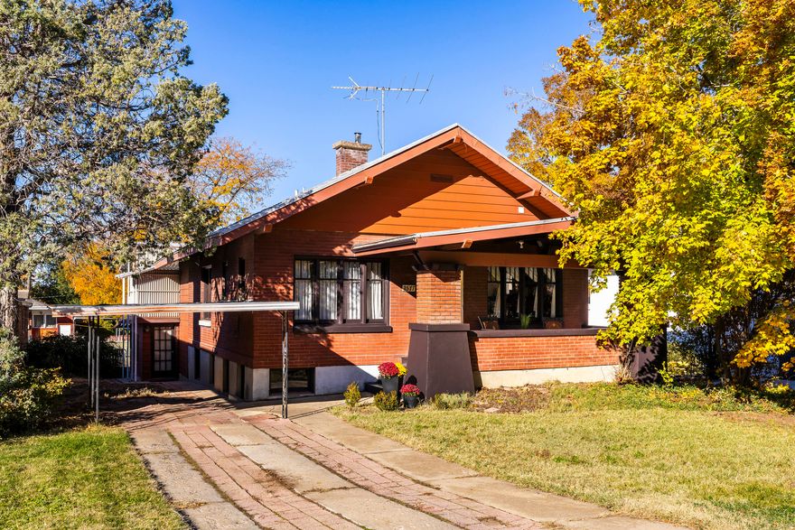 This classic Craftsman-style bungalow seamlessly blends timeless character with modern updates. Hardwood floors, original wood trim, and multiple fireplaces reflect the home's rich history, while stunning renovations to the kitchen, main bathroom, and utilities provide contemporary comfort and convenience. The chef's kitchen is designed for everyday living and entertaining, featuring custom cabinetry with abundant storage, sleek quartz countertops, stainless steel appliances, floating shelves, and a bar counter that completes the space beautifully. Recent renovations to the kitchen and primary bathroom included extensive electrical and plumbing upgrades, as well as the addition of a high-efficiency HVAC system with a heat pump - an exceptional bonus. The home offers generous square footage that flows to bedrooms and a main family room with walk-out access to the backyard. An upper-level covered deck provides the perfect spot for year-round barbecues and sunset views. The lower level adds even more living space with an additional family room, complete with a stone fireplace and large windows that fill the space with natural light. With a main living room, two family rooms, and a large utility room, this home offers incredible flexibility to suit your lifestyle-whether you need a home office, workout space, entertainment area, gathering rooms or storage spaces. Secondary access to the single-car garage provides additional parking, and an attached shed with multiple windows and a separate entrance offers exciting potential as a workshop or artist's studio. The fully fenced backyard is ready for xeriscaping, landscaping, or creating a play space. Located on the East Bench in one of Ogden's most sought-after neighborhoods, this home invites you to relax on the spacious front porch while enjoying mountain views or stroll just a few blocks to nearby trailheads for hiking, biking, and rock climbing. This highly walkable neighborhood features a local coffee shop around the corner, along with easy access to public transit, schools, and parks. Just minutes from historic 25th Street in downtown Ogden and offering convenient access to world-class ski resorts, this home delivers the perfect blend of location, lifestyle, and character.