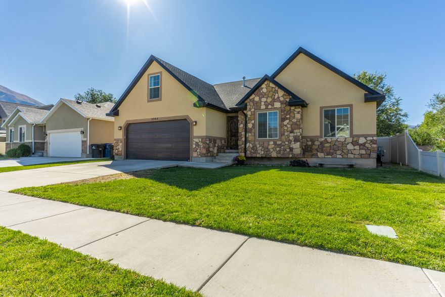 This beautiful home features an open-concept floor plan with vaulted ceilings, custom wood throughout the main living areas, a loft area for additional living space, new carpet, paint and updates, and gorgeous mountain views.  This home sits in a secluded neighborhood and has no backyard neighbors. The kitchen offers beautiful granite countertops, ample cabinet space, a step-in pantry, and a large picture window with lots of natural light - perfect for daily living and entertaining.   Wake to the beautiful, wooded view in your primary suite that includes a private en-suite bath, ceiling fan, and walk-in closet.  The two additional main-floor bedrooms include spacious closets with French doors.  Upstairs, you'll find a loft area perfect for a playroom, family movies, or a retreat for teens, as well as an additional bedroom with Instagram-worthy views of the Wasatch mountains.  Enjoy the outdoors with your fully fenced backyard, automatic sprinkler system, flower beds, and plenty of space for grilling, playing and relaxing outside.   The unfinished basement offers space to customize and expand.   Square footage figures are provided as a courtesy estimate only and were obtained from county records.  Buyer is advised to obtain an independent measurement.