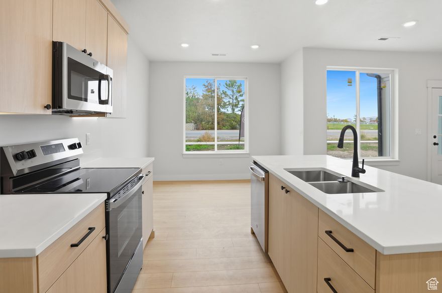 Built by Timber Brook Homes, one of Tremonton's most trusted builders, this mid-row new construction townhome blends quality craftsmanship with a clean, modern look. The light color scheme and open-concept layout create a spacious, inviting feel throughout the main level. Enjoy custom cabinetry, high-end finishes, and a well-designed kitchen and living area perfect for everyday living. Upstairs, the primary suite offers a large walk-in closet and double-sink vanity. Ideally located near town and the freeway, yet set in a quiet, well-kept community, this home combines style, comfort, and convenience. Also receive a $4,000 seller concession when using our preferred lender, Kaden Niemann with Bolt Home Mortgage.