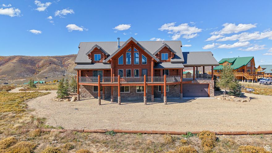 **Make sure to check out the 3D tour. Nestled in the serene, private gated community of Scofield, Utah, this stunning 5,000 sq. ft. log cabin offers unparalleled luxury and adventure with breathtaking lake and mountain views. Featuring 5 spacious bedrooms and 3.5 baths, this home boasts a grand open floor plan, perfect for entertaining. The high-end custom kitchen, complete with top-tier appliances, flows seamlessly into the living area, anchored by a beautiful two-story fireplace. Enjoy radiant floor heating throughout, complemented by brand-new, high-end Anderson windows and doors, and recently stained and re-sealed 12" log construction for timeless charm. This property is an entertainer's dream, with unique features like an indoor slide, theater room, climbing wall, and two thrilling zip lines. The expansive wraparound covered deck invites you to soak in the scenic beauty, while the basement kitchenette and walkout provide added convenience. Adventure awaits with an ATV track circling the property, and the two-car drive-through garage offers ample storage. Additional highlights include a central vacuum system and a meticulously maintained exterior. This extraordinary cabin blends rustic elegance with modern amenities, making it the ultimate retreat for relaxation and recreation. Additional 2.27 acre lot Available right behind this cabin. See pictures of those lot lines