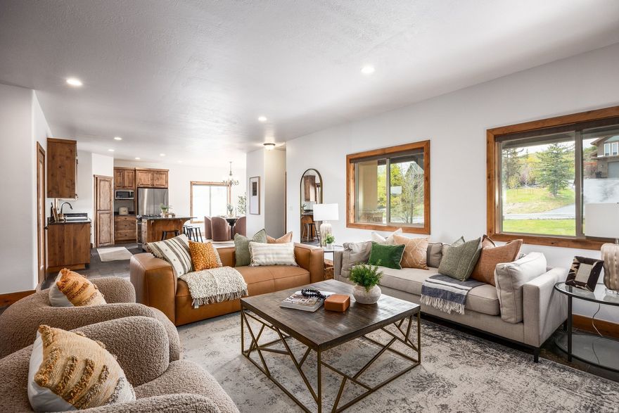 Located within the coveted Park City school district, this beautifully maintained home, tucked along a quiet street in the Highland Estates neighborhood, strikes a rare balance between privacy and convenience. Set on an expansive .89-acre lot, it offers a true sense of space with room to relax, grow, and take in the surrounding natural beauty. The thoughtfully designed floor plan features a main-level primary suite and a bright, walk-out lower level with two additional bedrooms and a spacious family room--ideal for guests or flexible living. Fresh interior paint and brand-new carpet (2026) give the home a crisp, move-in-ready feel, while quality finishes throughout include slate flooring, granite countertops, alder cabinetry, stainless steel appliances, travertine tile, and European glass accents. Zoned for horses and livestock, the generous lot also includes a versatile 1,000-square-foot barn with an electrical vertical lift, perfect for a workshop, RV storage, hobby space, or more. Located within the Park City School District and just minutes from Kimball Junction and historic Main Street, this property offers the best of quiet mountain living with effortless access to dining, shopping, and year-round recreation.